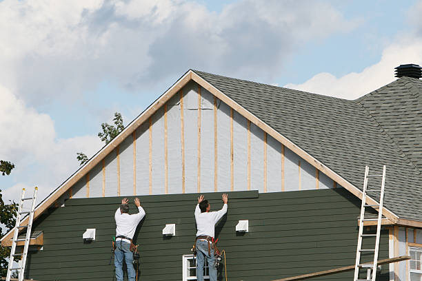 Professional Vinyl Siding technician working in Old Bethpage, NY